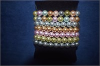 Seven Kenneth Jay Lane Pearl Bracelets in Box