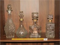 (4) Clear Glass Decanters - Located in Living