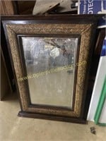 Beveled mirror and frame with wicker accent
