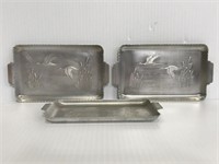 Three metal embossed duck mini trays