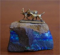 Small opal rock with mounted stag sculpture