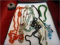 Showcase of jewelry. Necklaces, pins and more.