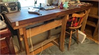 Wooden table approximately 7 feet long and 3.5