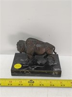 Bronze buffalo on marble stand