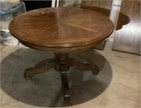 40" round oak pedestal table with two 18" leaves