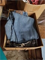 Box of jeans and shirts.