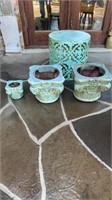 4 pc teal colored concrete pots and a metal table