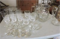 Water pitchers, crystal tumblers, candle sticks