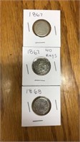3 shield nickels. 2 are 1867, 1 is 1868