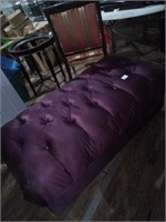 Oversized  dark purple ottoman on rollers