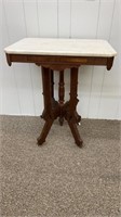 Eastlake walnut table with a marble top