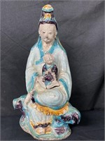 Multicolor Chinese woman holding baby figure
