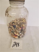 Large mason jar of jewelry and buttons
