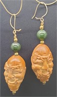 (D) Carved Asian Face with Jade Bead Pierced
