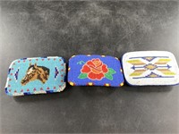 Three intricately beaded belt buckles in Native Am