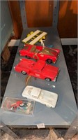 Shelf lot of antique toy cars and trucks