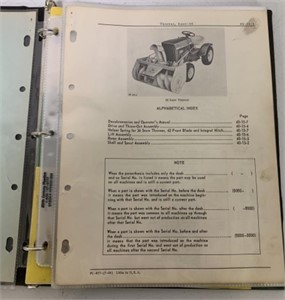 Binder of John Deere Parts Catalogs
