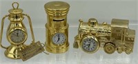 3 Miniature clocks- one Has a tag that says