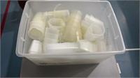 Plastic tub with contents (measuring cups)