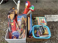 Two boxes of assorted toys puzzles crayons games