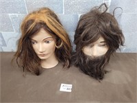 2 mannequin heads with hair