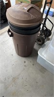 Four plastic trash cans