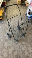 Metal clothes or shopping basket on wheels