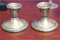 A Pair of Weighted Sterling Candlesticks