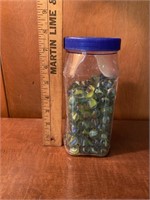 Plastic container of marbles