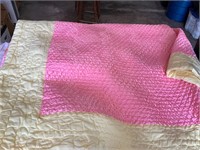 pink and yellow bedspread
