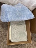 Box of blue bathroom rugs
