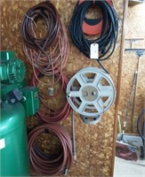 Lot of electric chord and air hose.