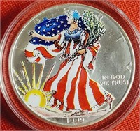 (49) -  1 OZ FINE SILVER 1999 COLORIZED $1 COIN