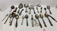 Assortment of mostly Silver Kitchen Utensils.