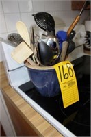 blue crock and kitchen utensils