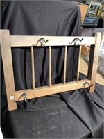 Wooden rack with coat hooks