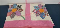 Vintage hand sewn floral quilt.