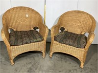 Pair of wicker chairs with padded seats
