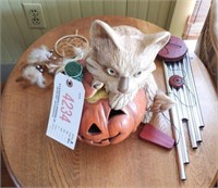 Ceramic Cat and Jack-O-Lantern and wind chimes