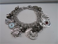 STERLING SILVER CHARM BRACELET (APPROX 17 CHARMS)