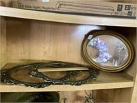 Two brass, oval frames, and small mirror