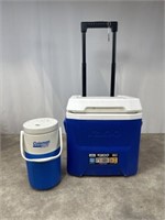 Small igloo rolling cooler and Coleman water jug