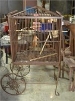 Metal framed wire bird cage on wheels