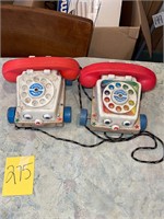 pair of VTG Fisher Price toy telephones