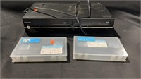 Toshiba VHS and DVD player and 2 VHS Tapes