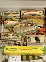 Old wooden fishing lures with boxes