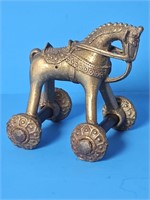 VERY NICE VTG BRASS HORSE TOY ON ROLLING WHEELS