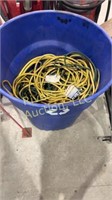 Garbage bin filled with extension cords
