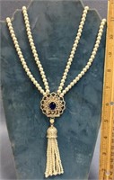 Faux pearl necklace with a blue stone pendant, 19"