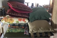 Assortment of blankets and pillows